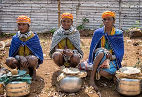 New Beyond trips Tribe crossing a stream Orissa India